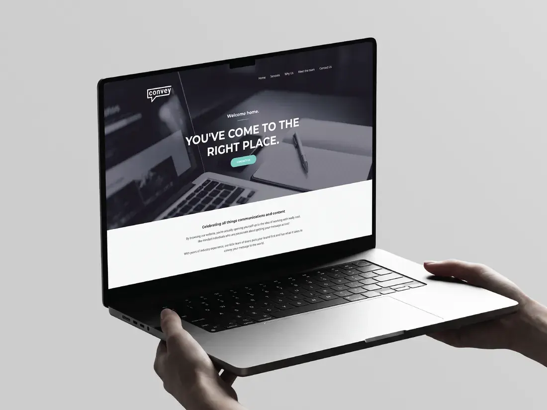 Laptop held in two hands showing the Convey Communications website hero with the line You’ve come to the right place.