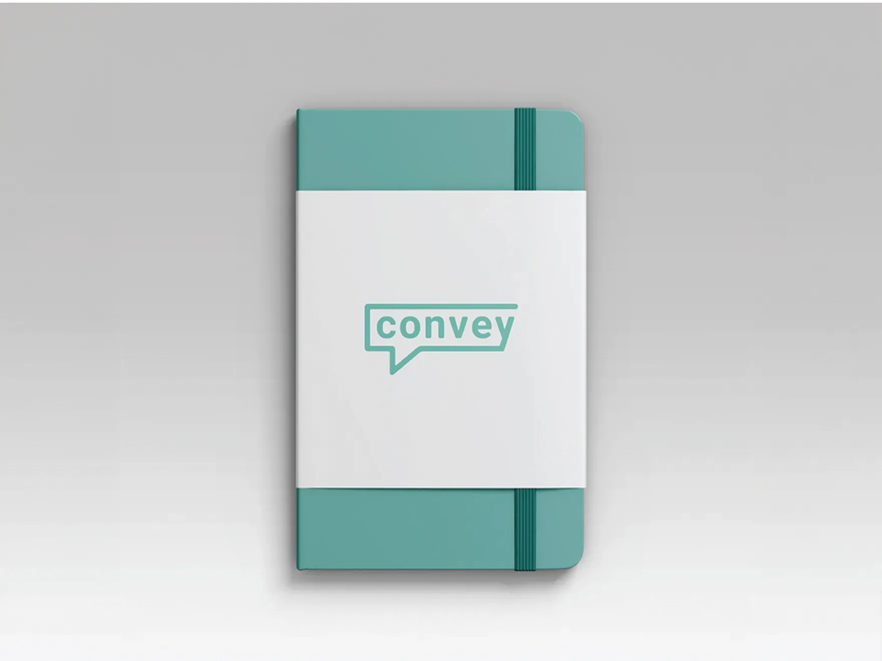 Grey notebook with a teal elastic band and the Convey speech-bubble logo on the cover.